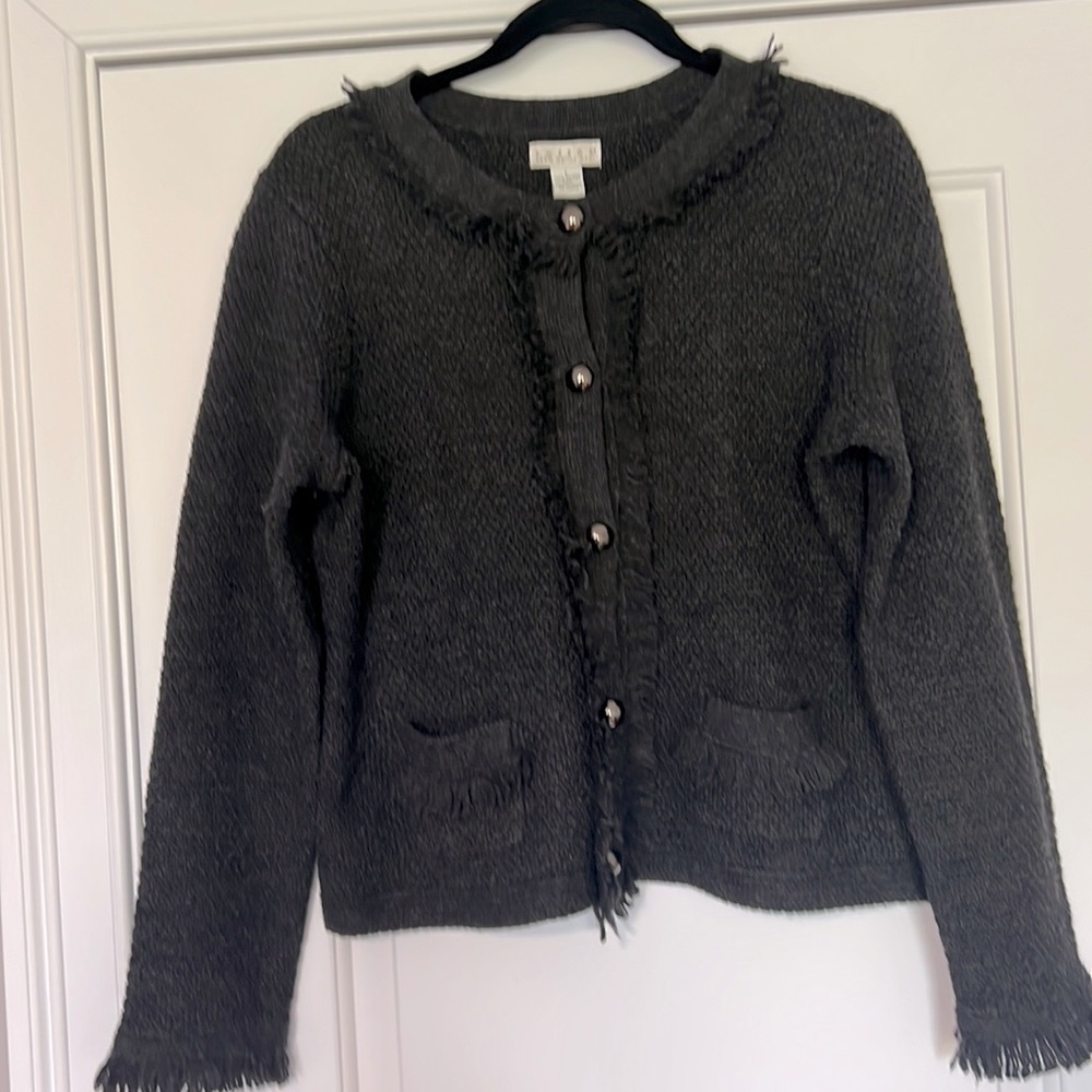 100% Merino wool cardigan. Very stylish and timeless design